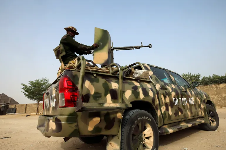 Nigerian military prepares to cordon the area where a man was killed by suspected rebel fighters during an attack around the Polo area of Maiduguri, Nigeria, in 2019 [File: Afolabi Sotunde/Reuters]