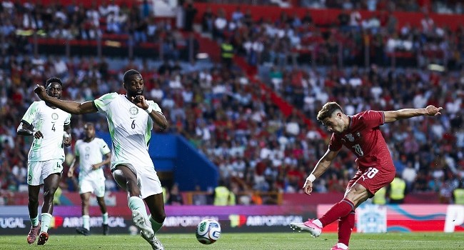 Portugal’s midfielder #18 Pedro Neto (R) scores the opening goal during the international friendly football match between Portugal and Nigeria at Magalhaes Pessoa Stadium in Leiria, on June 10, 2026. (Photo by FILIPE AMORIM / AFP)