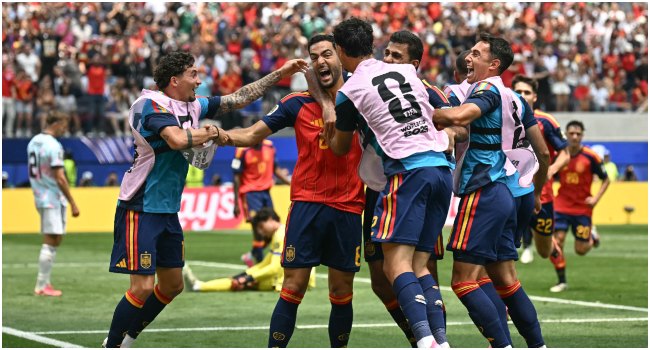 Spain’s midfielder #06 Mikel Merino celebrates scoring his team’s second goal with teammates during the 2026 World Cup football tournament quarter-final match between Spain and Belgium at the Los Angeles Stadium in Inglewood on July 10, 2026. (Photo by Paul ELLIS / AFP)