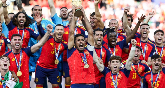 Spain’s midfielder Rodri lifts the trophy with his teammates after winning the 2026 World Cup football tournament final match between Spain and Argentina at the New York/New Jersey Stadium in East Rutherford on July 19, 2026. (Photo by FRANCK FIFE / AFP)