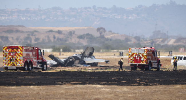Fire crews work around the wreckage of a US Marines’ F-35B fighter jet after it crashed into a field near Miramar Air Base in San Diego, California, on July 31, 2026.